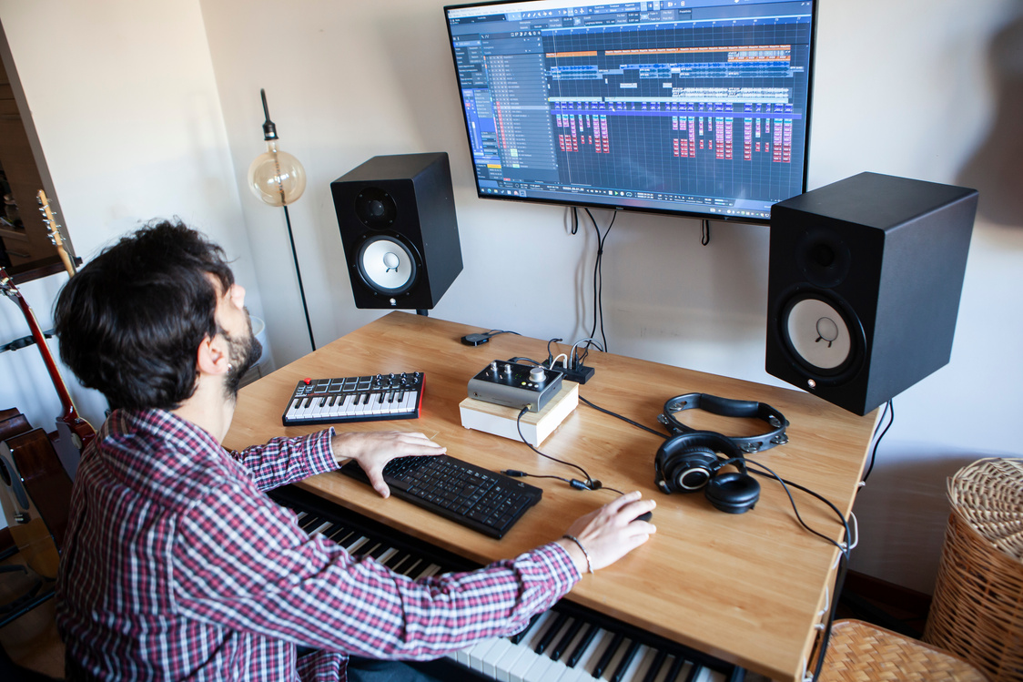 Producer Composing Music in Home Studio
